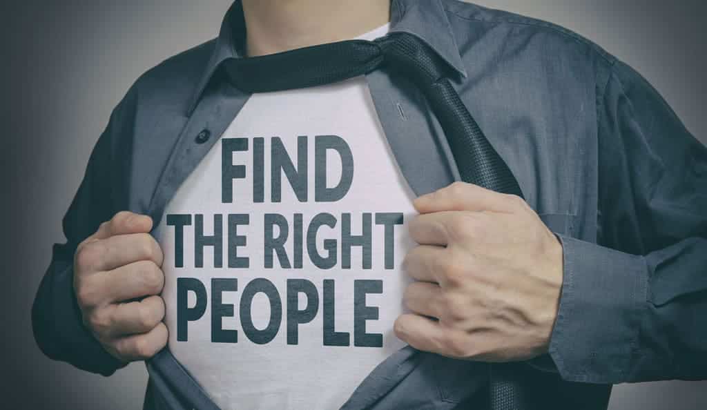 man opening shirt revealing a message, "find the right people"