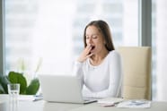 woman yawning from reading too much text on website