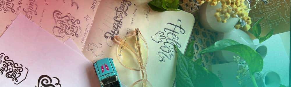 glasses sitting on top of different brand logo sketches created by human designers