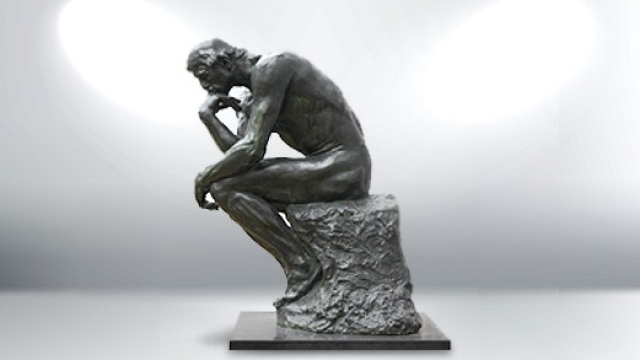 thinking-man-statue-with-photography-lighting