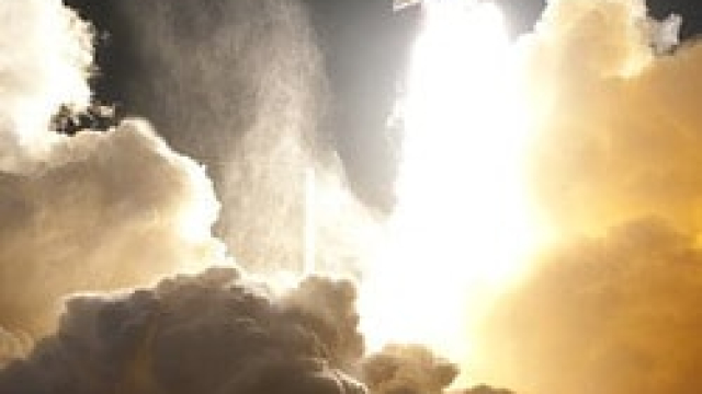 a picture of a rocket launch and the fire and smoke left behind from the launch