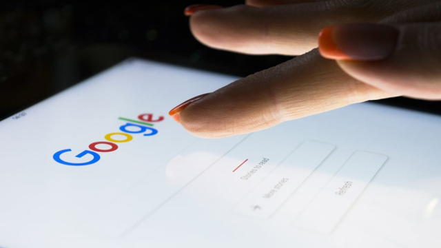 woman's finger doing a google search on a tablet
