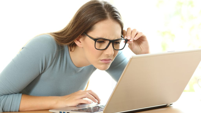 woman on laptop frustrated with web design navigation
